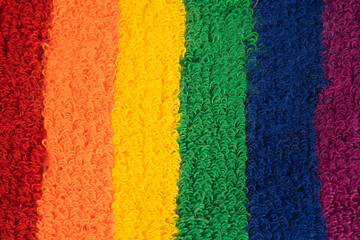 Fototapeta na wymiar Rainbow colour cloth towel, symbol of pride month lesbian, gay, bisexual, transgender, human rights, tolerance and peace.