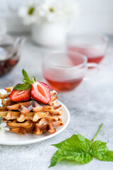 Delicious fresh baked belgian waffles with berries and fruit