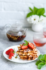 Delicious fresh baked belgian waffles with berries and fruit