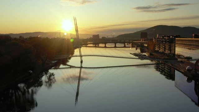 Sunrise in Drammen city, Norway.The bridge in the foreground is called Ypsilon, and the building with glass facade is the new and modern library. 