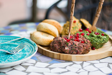 Georgian traditional food Pkhali, meal and dish with vegetables and pomegranates.