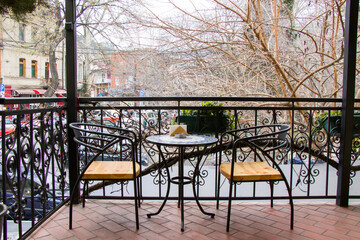 Restaurant and cafe table and chairs on the balcony, interior of restaurant in old town