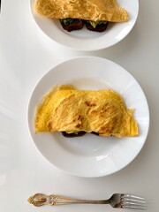 fried eggs on a white plate