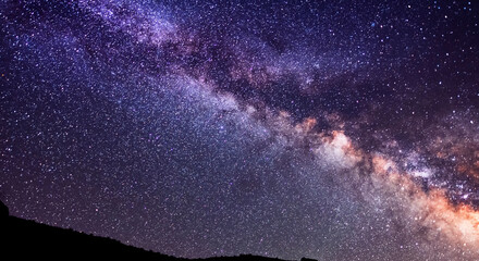 Beautiful starry sky with bright milky way galaxy. Night landscape. Astronomical background.