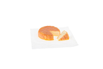 Camembert on paper, wedge of cheese.