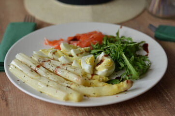 Breakfast with salmon, rucola, egg and asparagus