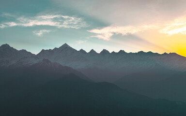Mountain silhouette of Panchchuli peaks during morning sunrise in great Himalayan mountain chain range from Khalia Top at small hamlet Munsiyari, Kumaon region, Uttarakhand, India.