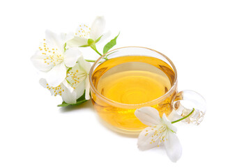Cup of green tea with jasmine flowers