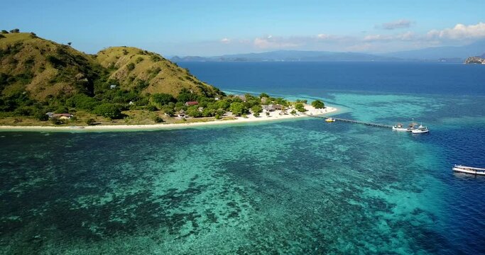 Aerial day view of the idyllic island of Kanawa located in Flores known for its beautiful beaches, near the city of Labuan Bajo, Indonesia