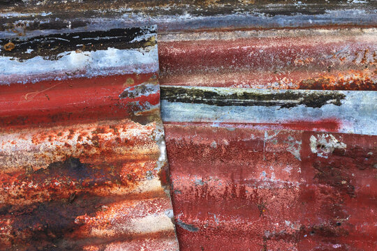 A close up of colorful rusty metal roofing for an abstract background image.