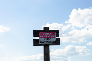 Private property - no entry sign in Polish. The sign informs about private property and no trespassing.