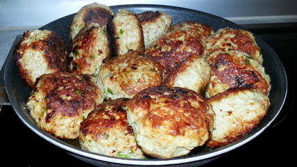 fried meat patties, homemade food, fried until golden brown in a pan