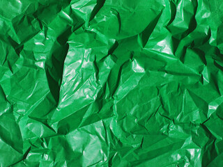 Green crumpled paper background or texture.