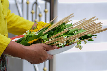 Flowers, joss sticks and candles, prepare sacred offerings