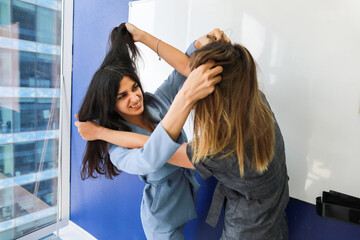 Fototapeta premium two girls fight in the office