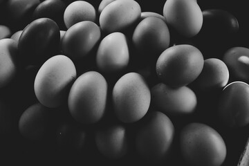 Group of eggs close up in black and white.