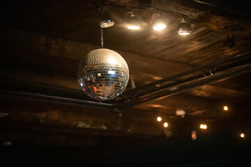 Disco ball under the ceiling in the restaurant