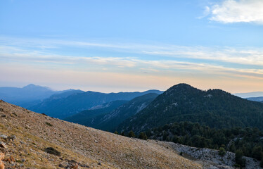 Beautiful mountain landscape with sunset over Taurus Mountains from the top of Tahtali Mountain near Kemer, Antalya, Turkey. 