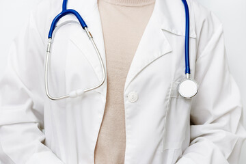 Medicine doctor close up in white coat with stethoscope. Healthcare and medical concept.