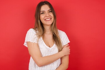 Fototapeta premium People, lifestyle, youth and happiness concept. Shy pretty girl feeling happy after boy who she likes invited her out on date.