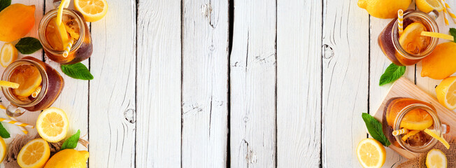 Sweet summer iced tea banner with double side border. Above on a white wood background with copy space