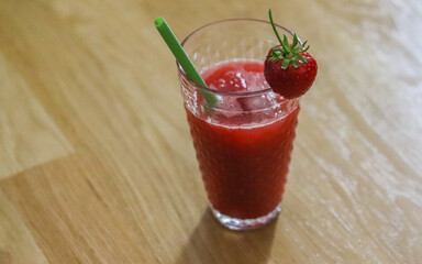 Strawberry alcoholic drink with ice