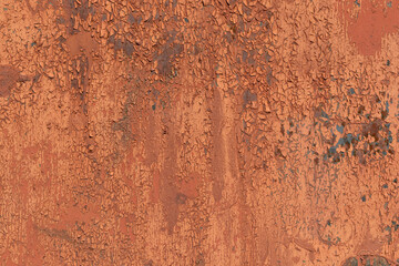 Metal surface with old paint for backdrop. Peeling flakes. Color - Whiskey, Sante Fe, Hue Orange.