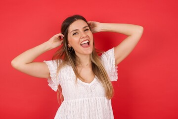 Confidence and coquettish concept. Portrait of charming young girl, smiling broadly with...