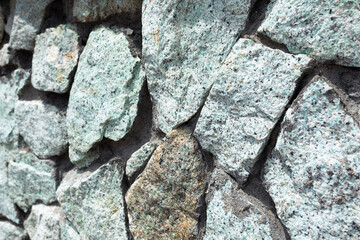 a fragment of a gray-blue stone wall for the background or texture.