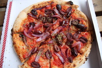 Vegetable italian pizza with olives and onion on tomato sauce