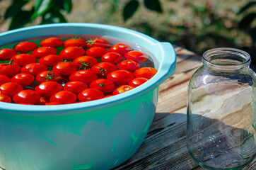 Harvest of red ripe tomatoes before winter preservation in glass jars
