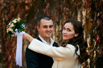 Young male and woman just married. Concept of happy family. Modern family outdoor.