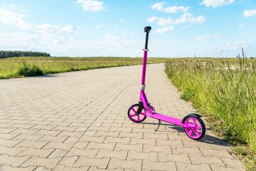 baby scooter for a girl on a bike path