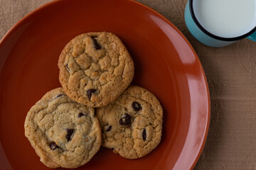 plates of succulent cookies with cup of milk