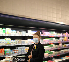 supermarket shopping, face mask and gloves,Woman choosing a dairy products at supermarket			