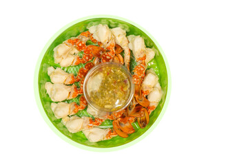 .Fresh steamed crab select crab claw on a plate with seafood sauce ready to serve in white background.