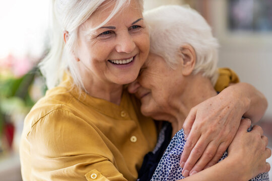 Woman Spending Time With Her Elderly Mother

