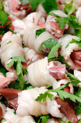 typical dish of the Puglia region in southern Italy called Gnemeridde made with lamb entrails cut and rolled and cooked on the grill