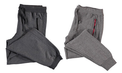 Folded gray jogging pants. Isolated image on a white background.
