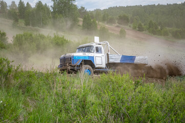 autocross on trucks and cars in summer, dirt, heat, dust