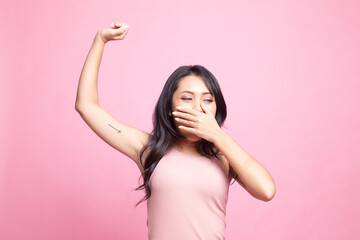Fototapeta premium Sleepy young Asian woman yawn.