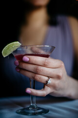 Hand holding a cocktail