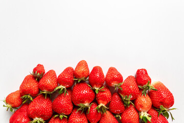 Frame made with strawberries on white background
