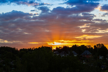 Beautiful sunset landscape with steaks of sunlight.