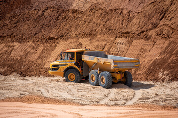 yellow truck on a sand quarry