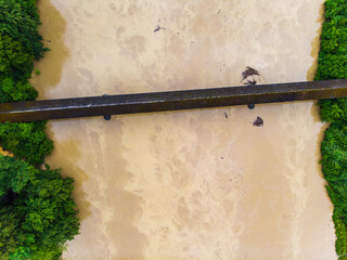 aerial view of bridge over river with flooding