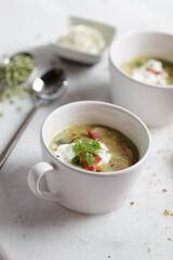 Green lentil beans cream soup with bacon in a glass