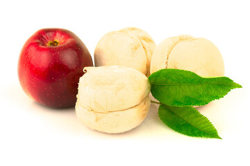 Red apple with marshmallows and green leaves