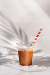 cup of cold orange drink 