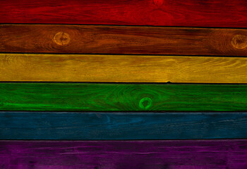 Rainbow gay pride protection symbol in wooden texture, wooden fence, flag concept lgbt.